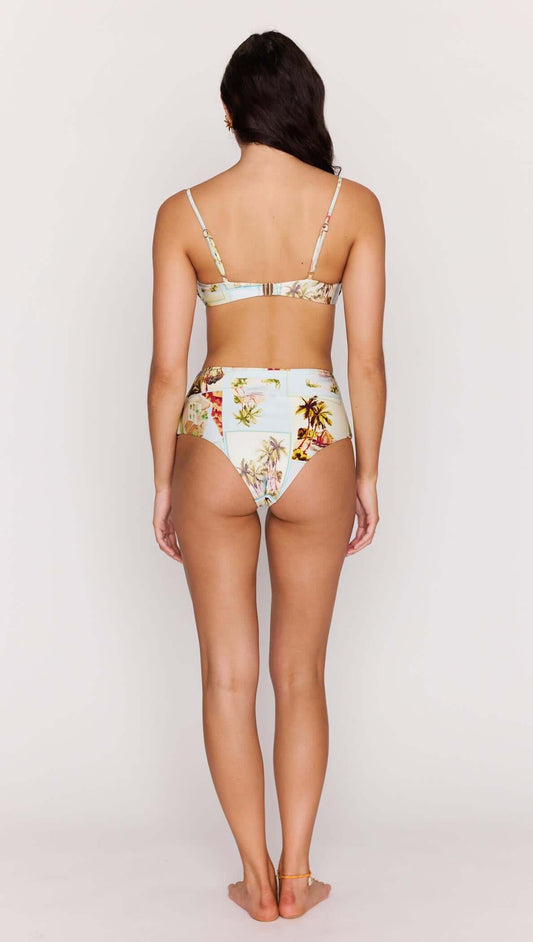 Back view of a model wearing a Palm Print Underwire Bikini Bra Top with high-waisted bikini bottoms, showcasing tropical prints.