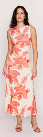 Model wearing the Peach Hibiscus Mesh Midi Dress with vibrant floral print, showcasing its flattering silhouette.