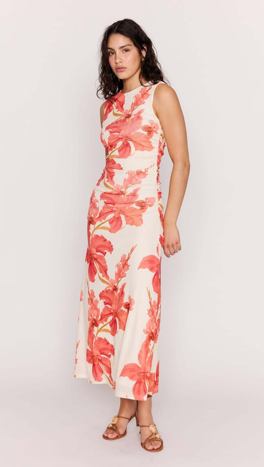 Model wearing the Isla Peach Hibiscus Mesh Midi Dress featuring a bold peach floral print and a flattering fit.
