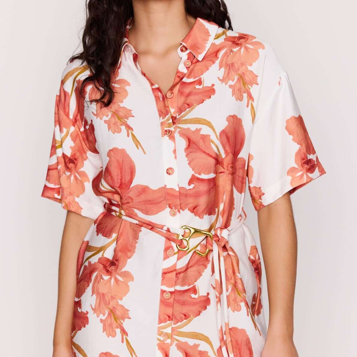 Model showcasing the Peach Hibiscus Mini Shirt Dress with vibrant floral print and detachable waist tie.