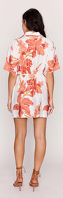 Peach Hibiscus Mini Shirt Dress featuring a relaxed fit, short sleeves, and a vibrant peach floral print.