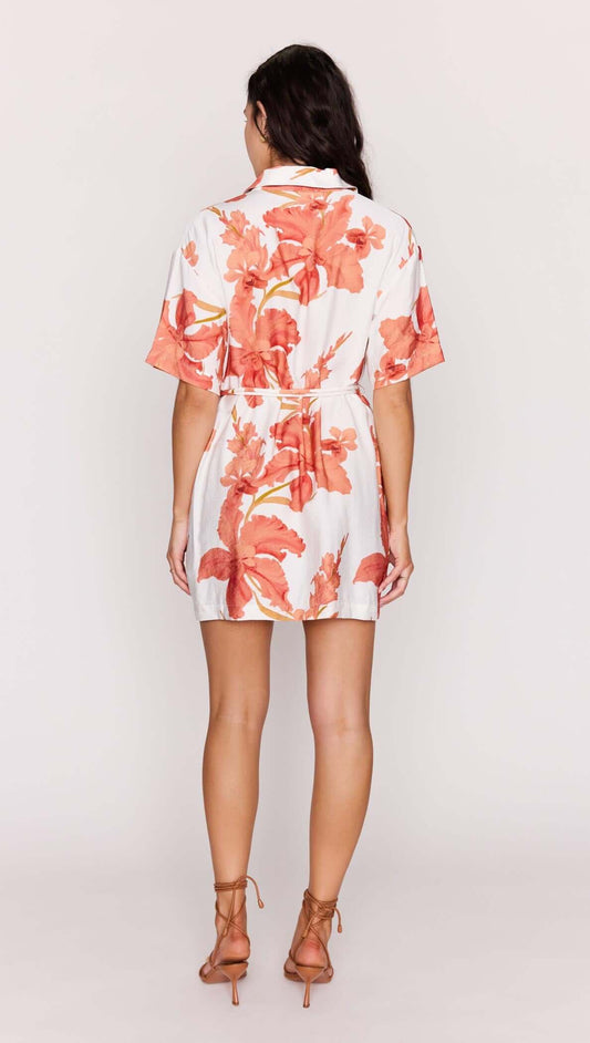 Peach Hibiscus Mini Shirt Dress featuring a relaxed fit, short sleeves, and a vibrant peach floral print.