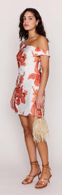 Model wearing the Peach Hibiscus Off Shoulder Mini Dress, showcasing the floral print and stylish silhouette.