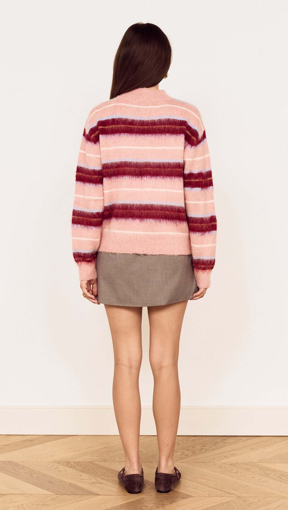 Back view of the Aspen Pink Brushed Stripe Crew Neck Sweater with pink and wine stripes.