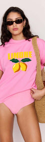 Model wearing a Pink Citrus Print Relaxed Oversized Cotton Tee with lemon graphic, perfect for summer vibes.