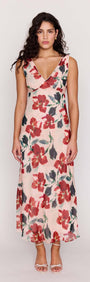 Model wearing a Pink Floral Bias Midi Dress featuring a deep V-neckline and vibrant floral print.