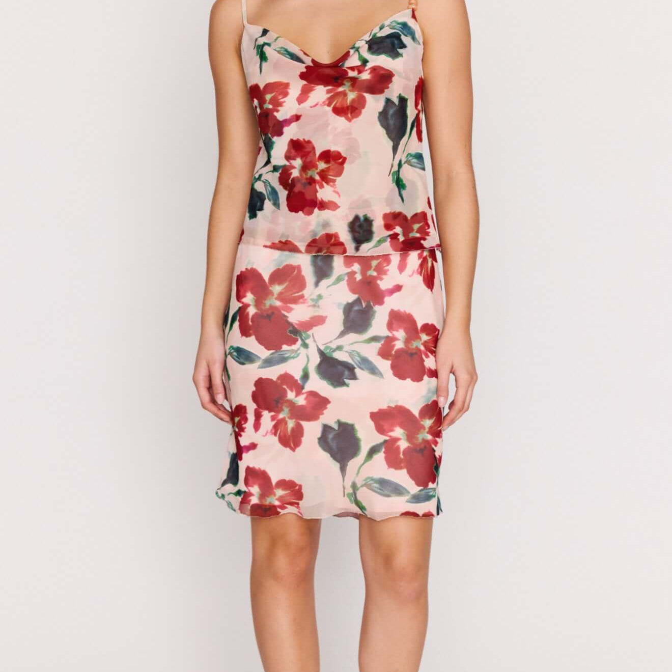 Model wearing the Pink Floral Bias Slip Skirt, featuring a floral print and a fluid silhouette.