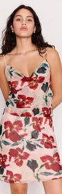 Model wearing a Pink Floral Bias Slip Skirt with a mesh floral top, showcasing a floral print and elegant silhouette.