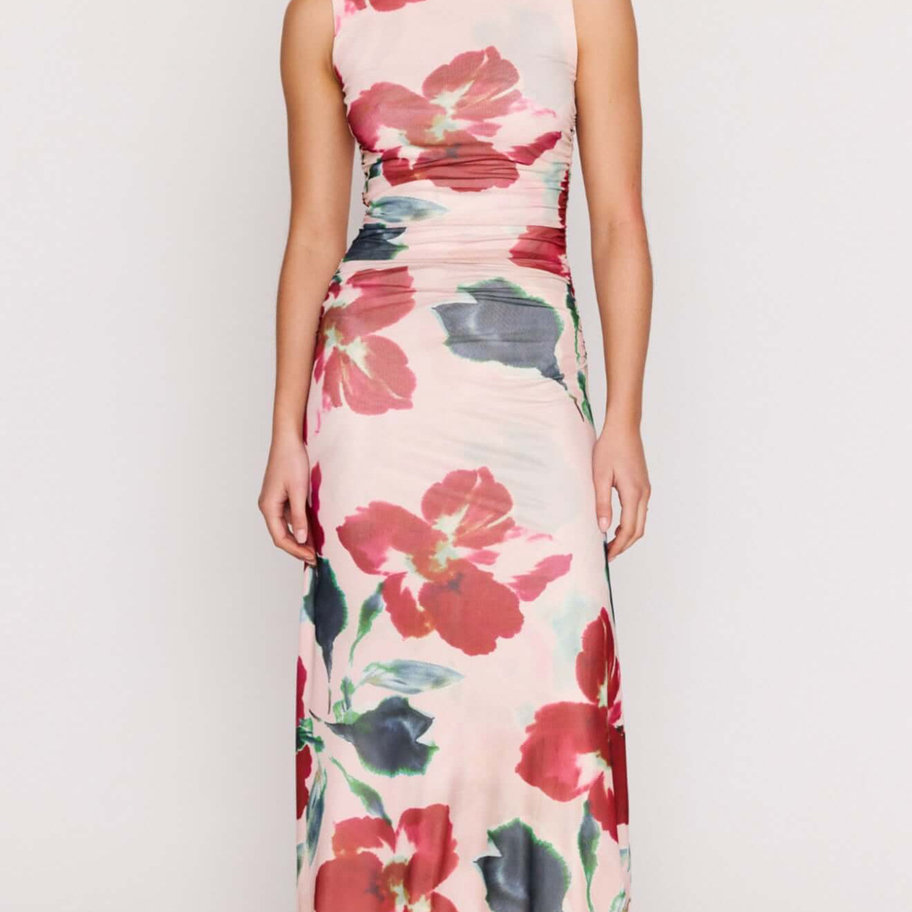 Pink Floral Mesh Midi Dress worn by a model, featuring vibrant floral patterns and a body-skimming silhouette.