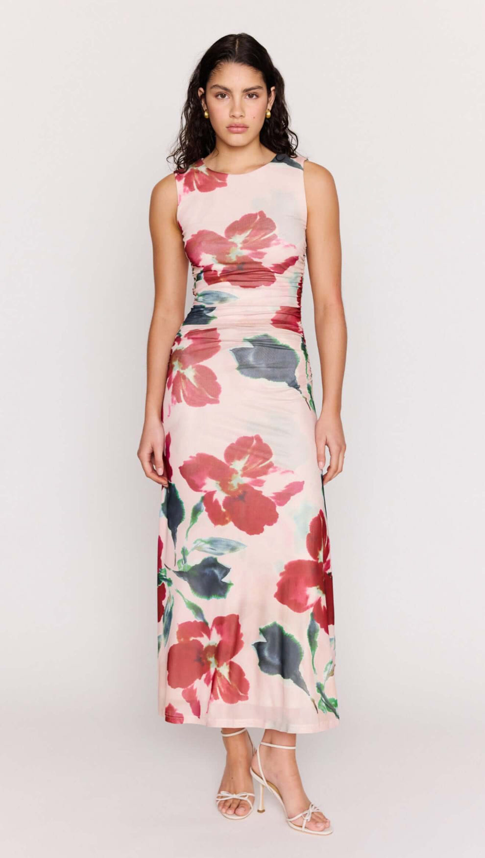 Pink Floral Mesh Midi Dress worn by a model, featuring vibrant floral patterns and a body-skimming silhouette.