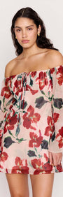 Pink Floral Off Shoulder Dress worn by a model, featuring a soft floral print and off-the-shoulder neckline.