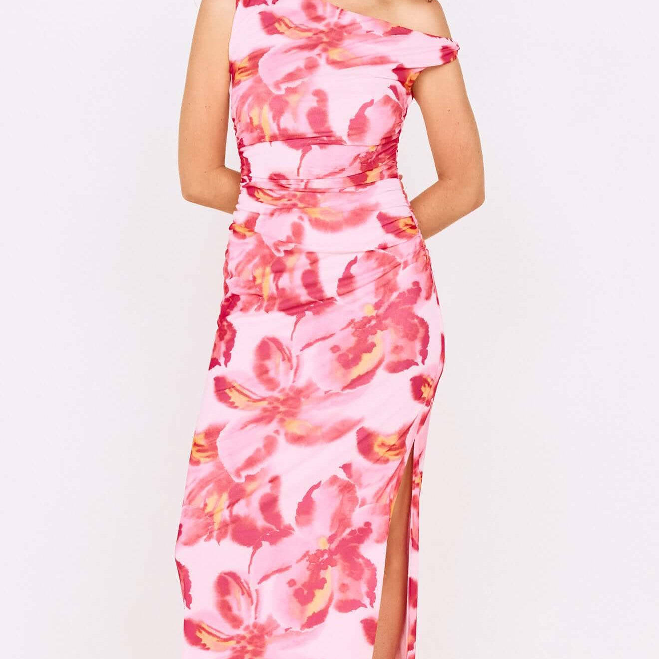 Pink Floral Off-Shoulder Mesh Midi Dress worn by a model, showcasing its vibrant floral design and elegant silhouette.