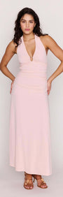 Pink Halter Neck Ruched Midi Dress modeled by a woman, featuring a plunging halter neckline and a figure-skimming design.