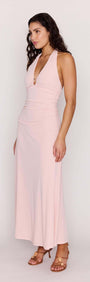 Pink Halter Neck Ruched Midi Dress worn by model, showcasing plunging halter neckline and flowy skirt.