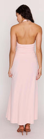 Back view of a model wearing the Pink Halter Neck Ruched Midi Dress in soft pink, showcasing its elegant design.