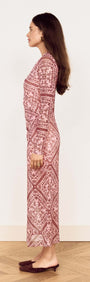 Model showing the side view of the Pink Paisley Long Sleeve Mesh Midi Dress on a wooden floor.