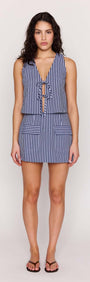 Model wearing a Pinstripe Tie Front Vest Top with deep V-neckline and adjustable ties in a stylish coastal look.