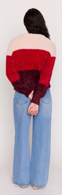 Back view of a model wearing the Red Colour Block Fluffy Cardigan with wide-leg jeans.