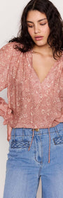 Red Floral Peasant Blouse featuring billowed sleeves and a vintage-inspired floral print on a silky fabric.