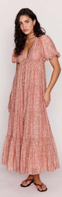 Red Floral Puff Sleeve Maxi Dress on a model, showcasing soft puff sleeves and a romantic tiered skirt.