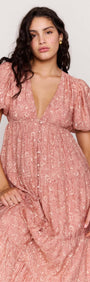 Red Floral Puff Sleeve Maxi Dress showcased on model with soft puff sleeves and deep V neckline, highlighting a relaxed fit.