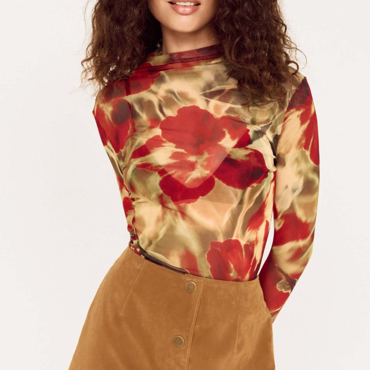 Model wearing a Red Floral Sheer Mesh High Neck Top paired with a stylish A-line skirt.