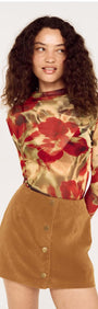 Model wearing a Red Floral Sheer Mesh High Neck Top paired with a stylish A-line skirt.