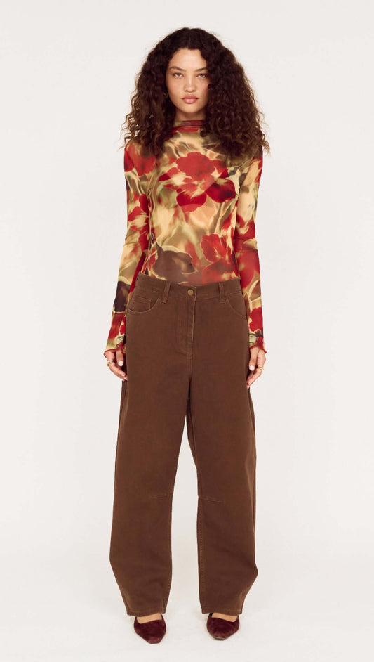 Red Floral Sheer Mesh High Neck Top styled with brown wide-leg pants, showcasing an elegant and casual look.