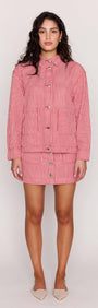 Model wearing a Red Pinstriped Denim Jacket styled with a matching mini skirt.