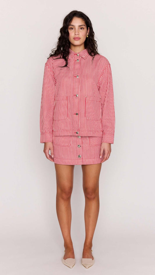 Model wearing a Red Pinstriped Denim Jacket styled with a matching mini skirt.