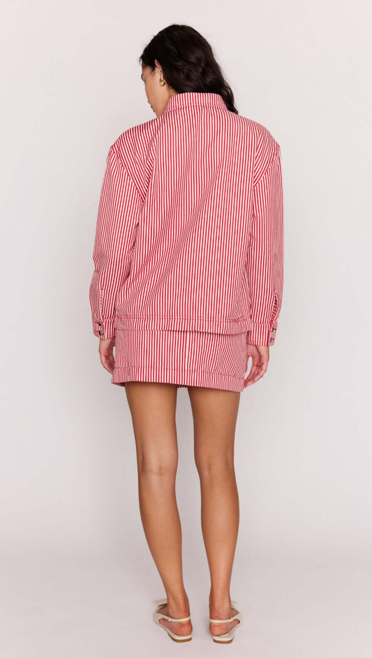 Red Pinstriped Denim Jacket worn as a stylish set with matching mini skirt, showcasing its relaxed fit and vertical stripes.