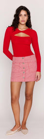 Model wearing a Red Pinstriped Denim Mini Skirt paired with a red long-sleeve top, showcasing a stylish summer outfit.