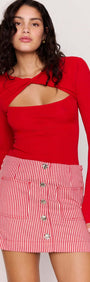 Model wearing a Red Pinstriped Denim Mini Skirt with a red long-sleeve top, showcasing a trendy casual look.