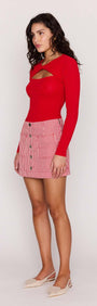 Model wearing Red Pinstriped Denim Mini Skirt with a red long-sleeve top, highlighting its stylish design.