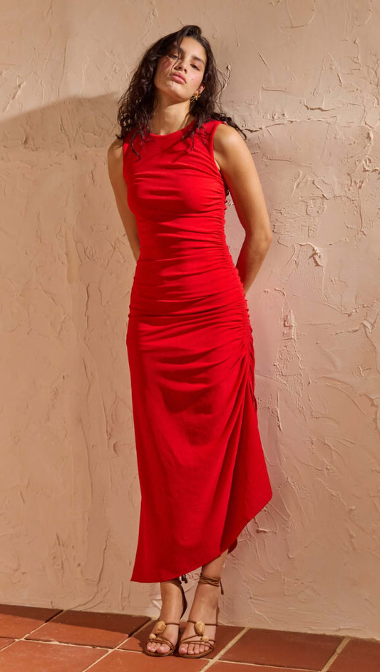 Red Ruched Stretch Midi Dress worn by a model featuring adjustable side drawstrings and subtle side split hem.