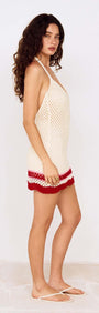 Model wearing the Red Stripe Crochet Halter Mini Dress, highlighting its playful crochet design and summer elegance.