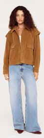Model wearing a Relaxed Fit Faux Suede Jacket with wide-leg jeans against a neutral background.