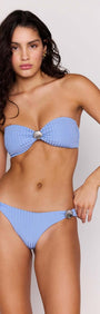 Model wearing a Sky Blue Shell Bikini Bottom paired with matching bandeau top, showcasing chic beach style.
