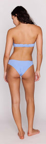 Model wearing Sky Blue Shell Bikini Bottom from the back, showcasing its chic hipster fit and elegant design.