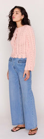 Soft Pink Cotton Pointelle Cardigan paired with wide-leg jeans, showcasing a delicate knit texture and feminine style.