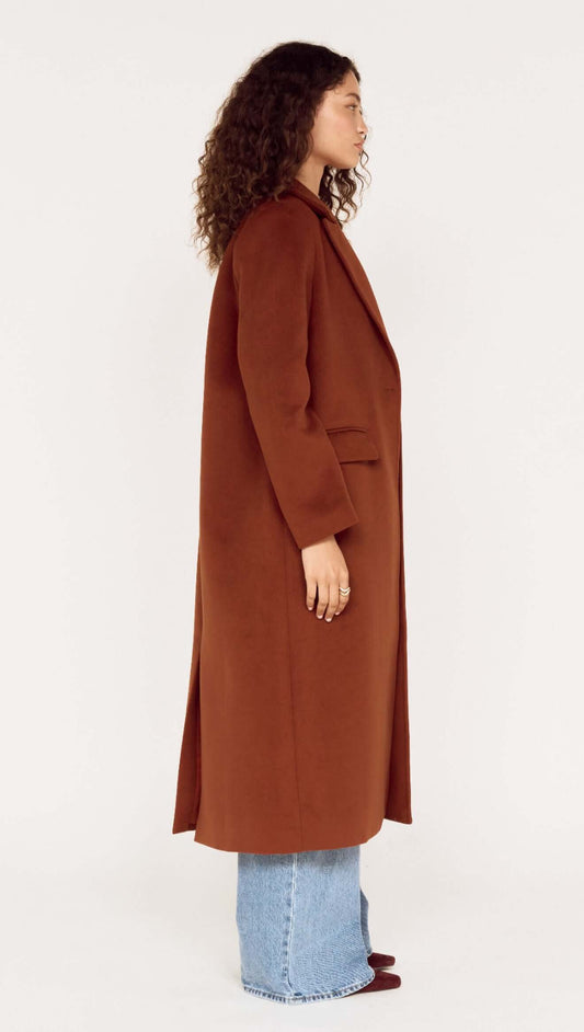 Model showcasing the Soft Touch Tailored Coat in Chocolate from the side, featuring a chic design and elegant silhouette.