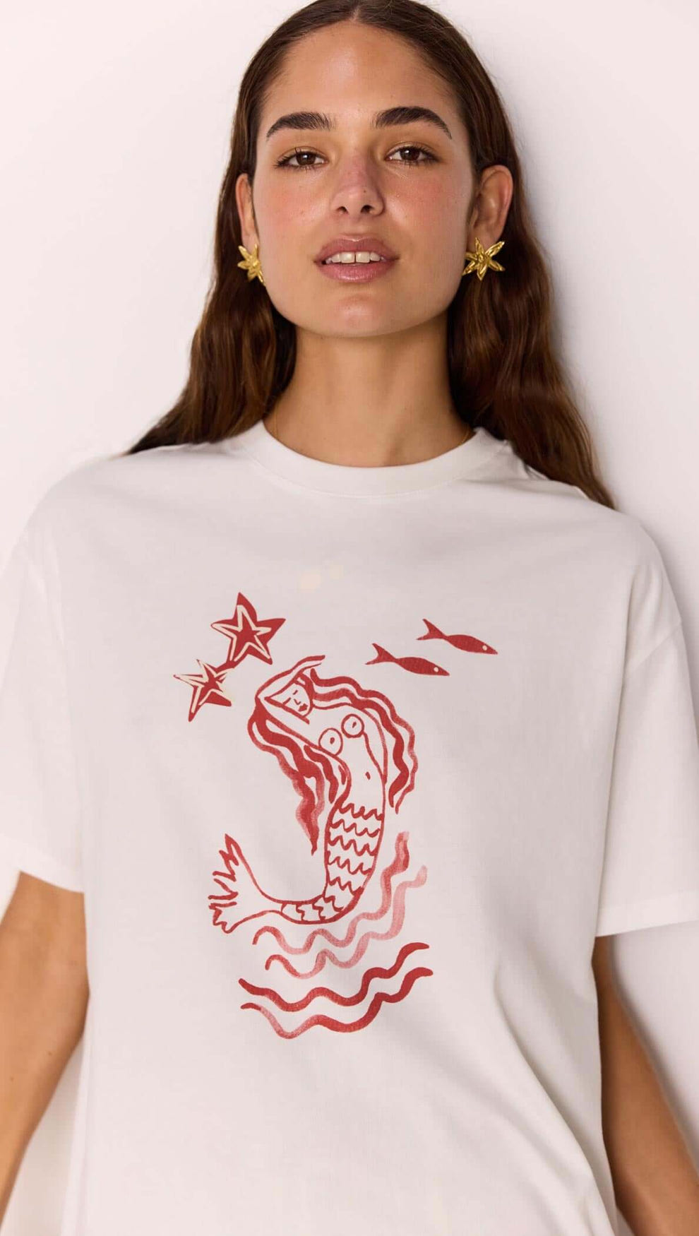 Cotton Mermaid Print T-Shirt featuring an exclusive mermaid artwork print in a relaxed fit and one-shoulder design.