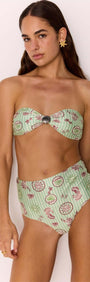 Model wearing a Green Stripe Printed Bikini Bandeau Top with Shell Detail, showcasing retro glam style on the beach.