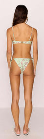 Back view of a model wearing the Green Stripe Printed Bikini Bra Top, showcasing its unique design and fit.