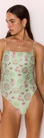 Model wearing Green Stripe Printed Low-Back One Piece Swimsuit showcasing vintage shell and sea motifs.