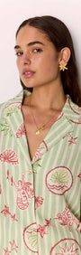 Model wearing a Linen Blend Green Stripe Printed Shirt featuring a sea-inspired design.