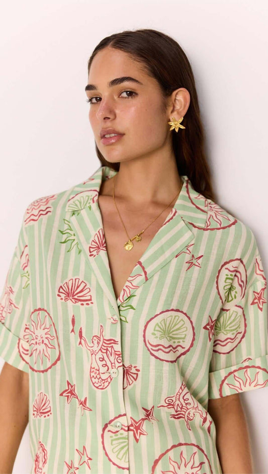 Model wearing a Linen Blend Green Stripe Printed Shirt featuring a sea-inspired design.