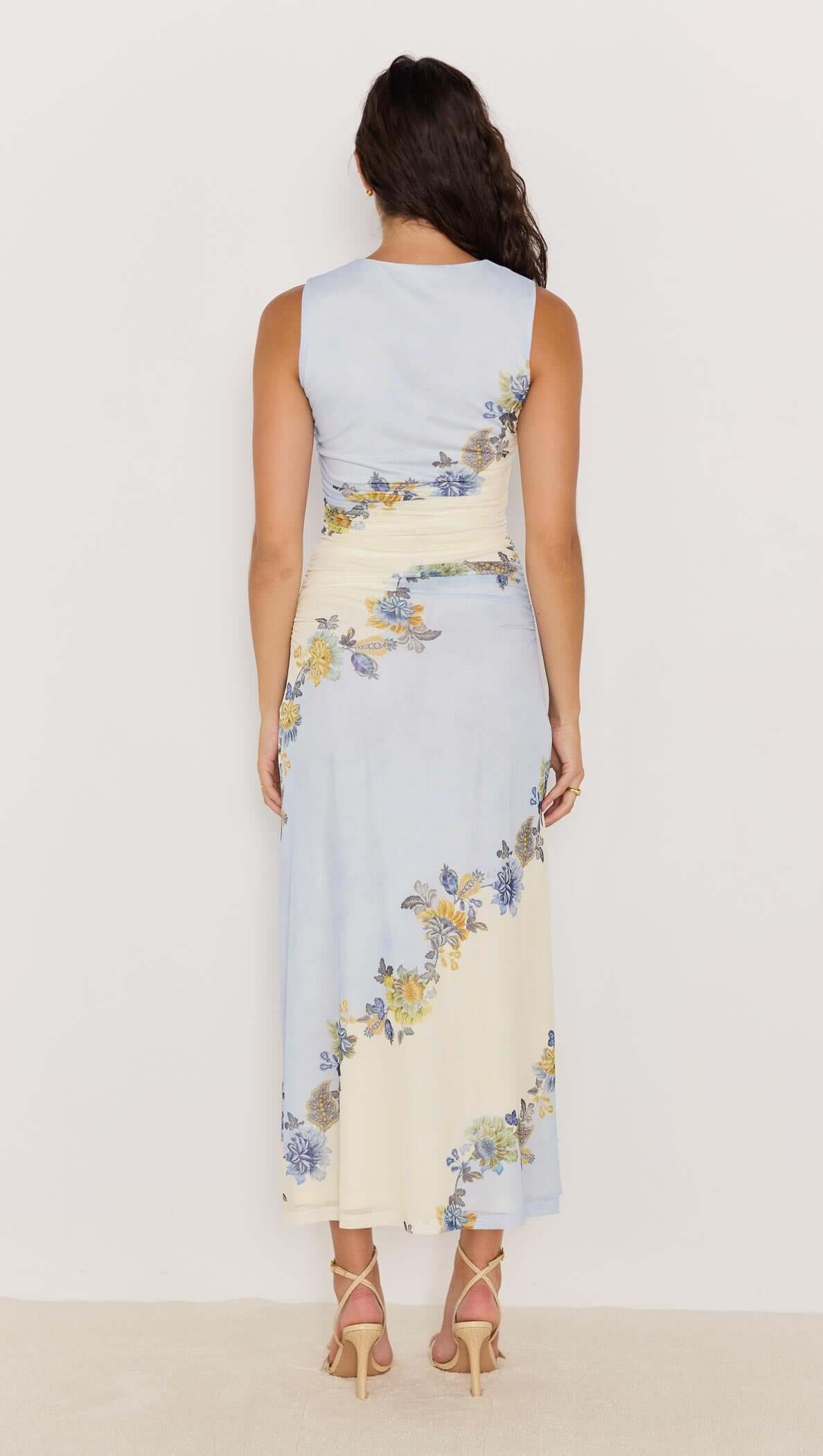 Back view of Lucia blue floral mesh maxi dress featuring soft watercolor design and floral accents.
