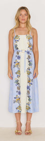 Lucia blue floral midi dress with tie waist, featuring spaghetti straps and a flowing skirt, perfect for warm weather.