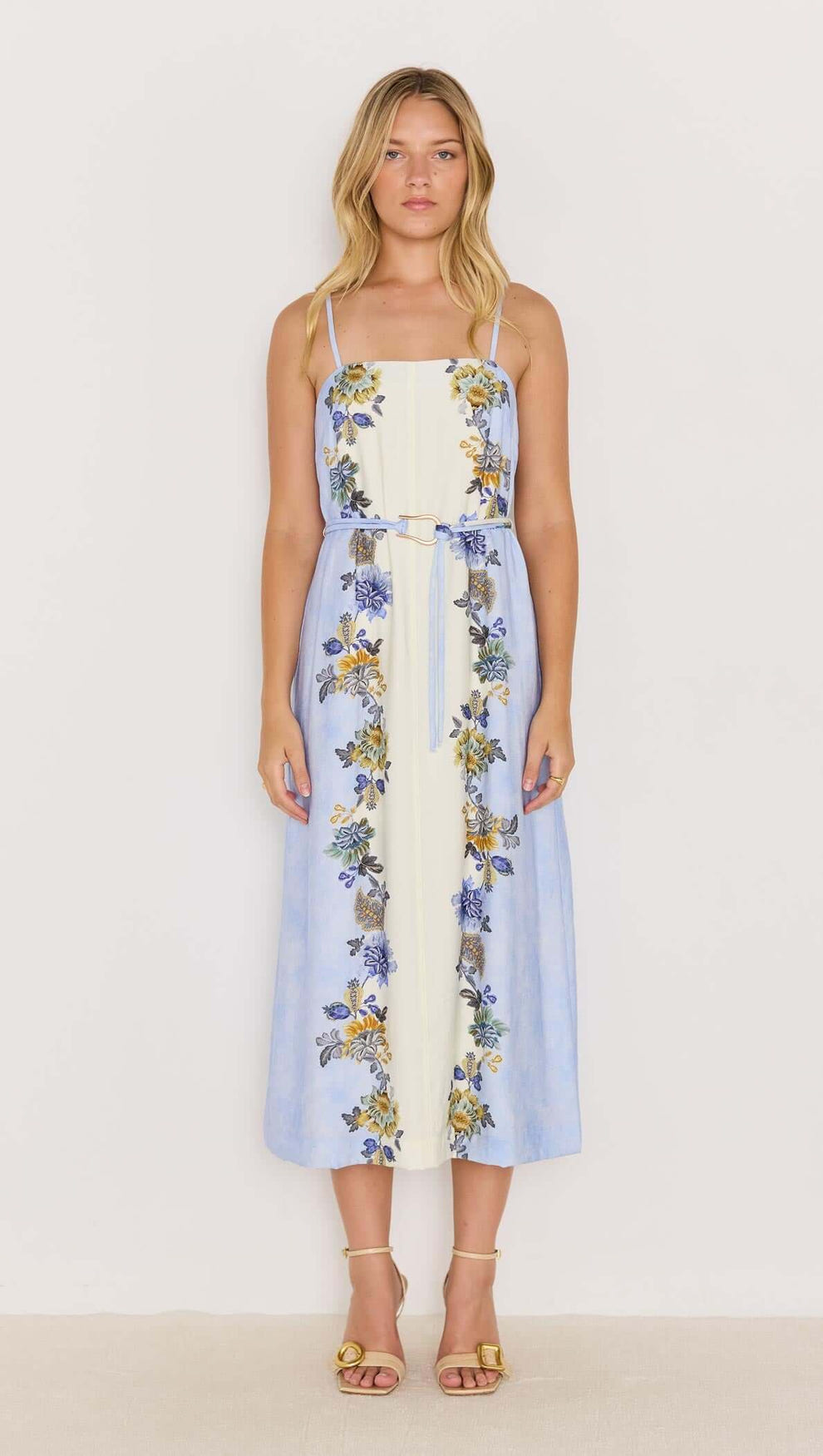 Lucia blue floral midi dress with tie waist, featuring spaghetti straps and a flowing skirt, perfect for warm weather.